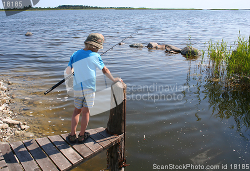 Image of Young boy fishing