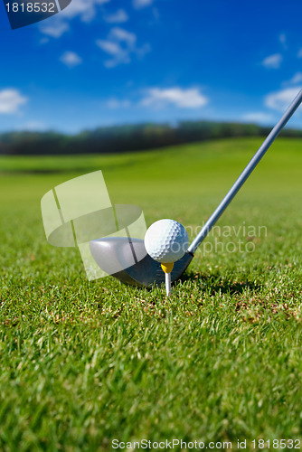 Image of Golf club with ball on tee