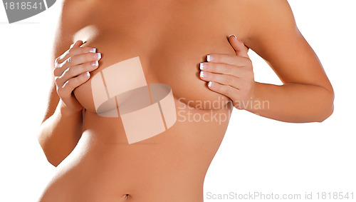 Image of close up, topless woman body covering her breast with hand, isol