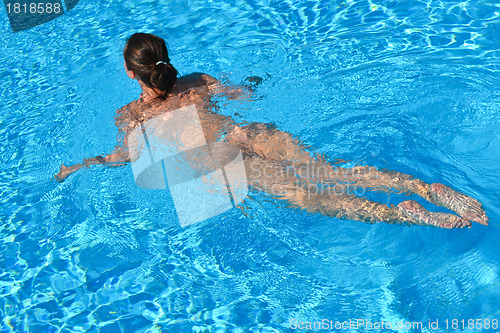 Image of Young woman swiming in the sea