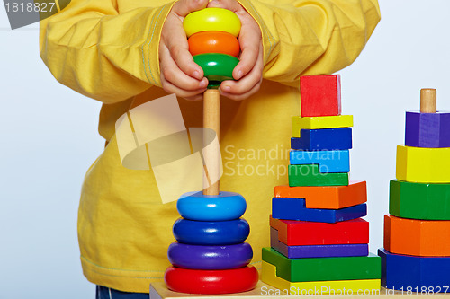 Image of boy playing with pyramid