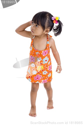 Image of wary little girl walking