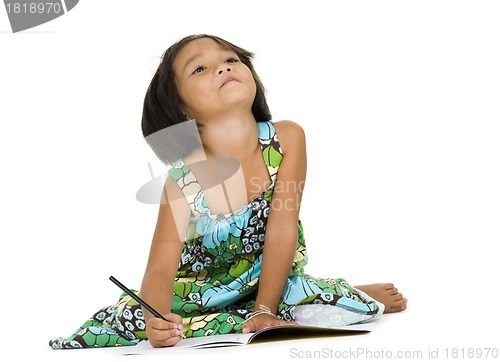Image of cute girl with notebook and pen