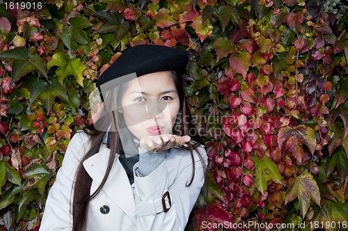 Image of autumn kiss from beautiful woman