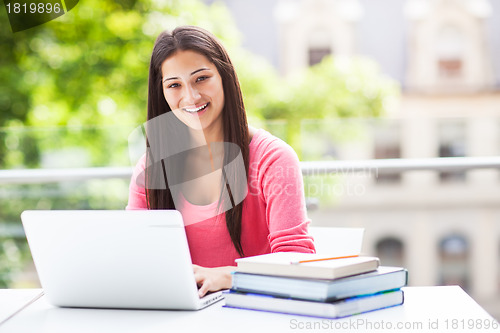 Image of Hispanic college student with laptop