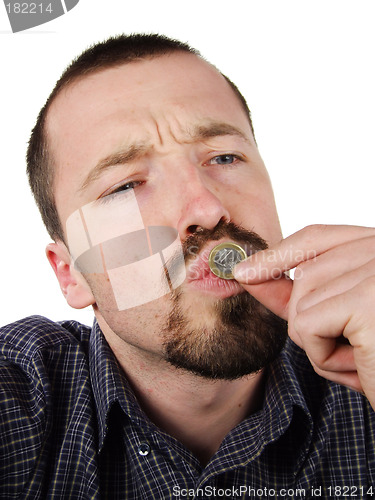 Image of Young male kissing a 1 Euro coin