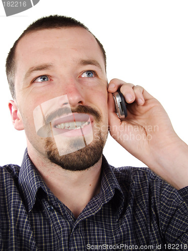 Image of Happy male talking to mobile phone