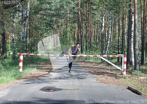 Image of  Man overcomes forbidding barrier