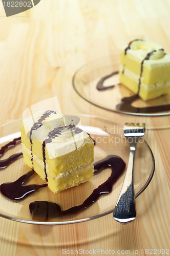 Image of fresh cream cake closeup with chocolate sauce