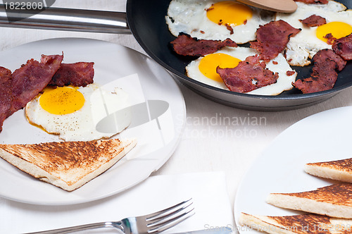 Image of eggs bacon and toast bread