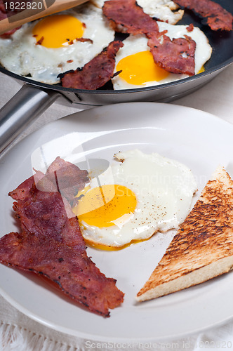 Image of eggs bacon and toast bread