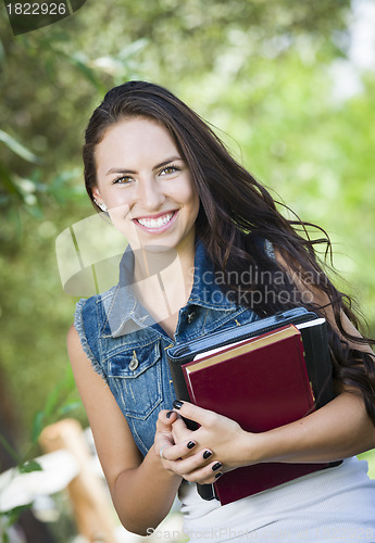 Image of Mixed Race Young Girl Student with School Books 