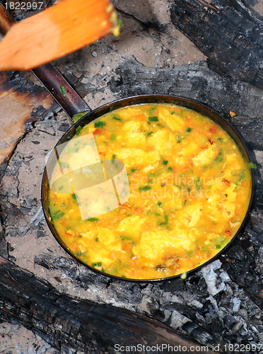 Image of cooking on campfire