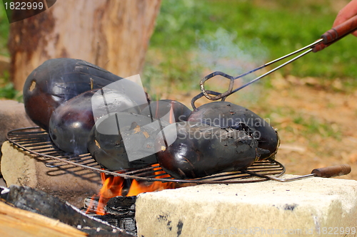 Image of eggplants on campfire
