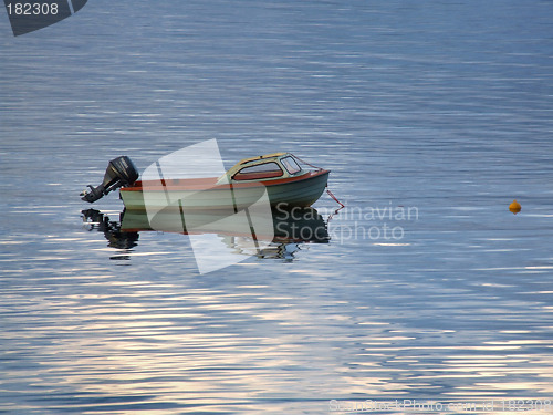 Image of Motorboat on calm bay water