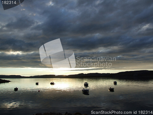 Image of Sunset over a bay with boats