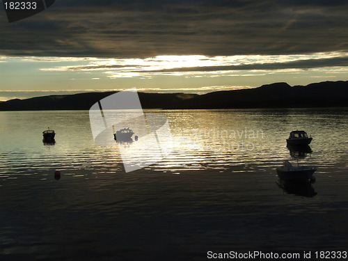 Image of Boats in the light of sunset