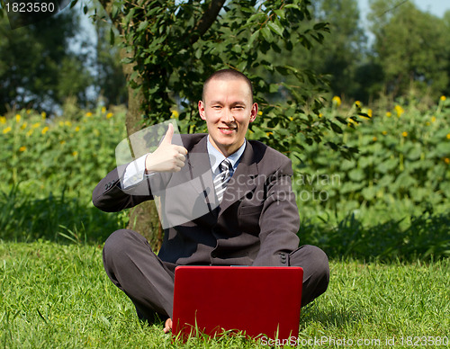 Image of Businessman Working Outdoors