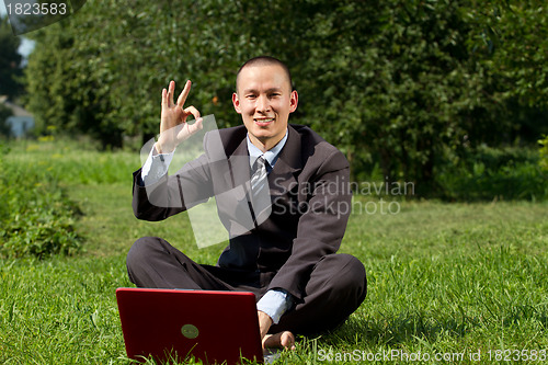Image of Businessman Working Outdoors