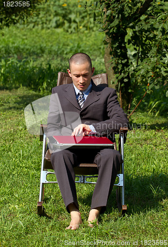 Image of Businessman Working Outdoors