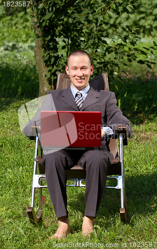 Image of Businessman Working Outdoors