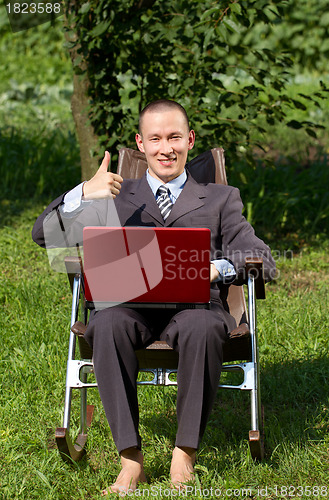 Image of Businessman Working Outdoors