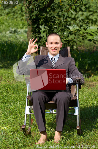 Image of Businessman Working Outdoors