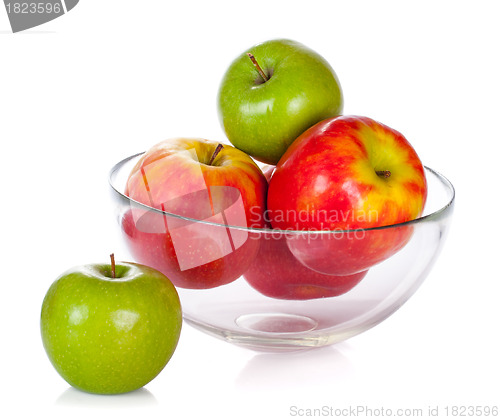 Image of Glass bowl with apples isolated on white