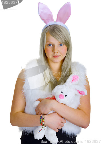 Image of Young blonde in a fancy-dress with toy rabbit
