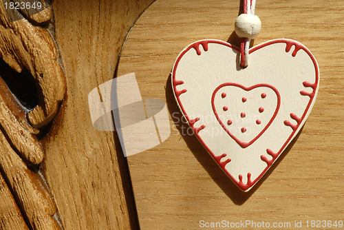 Image of heart hung on wooden door