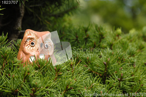 Image of toy owl in a tree