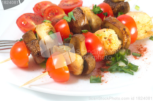 Image of Roasted chicken with mushrooms and tomatoes 