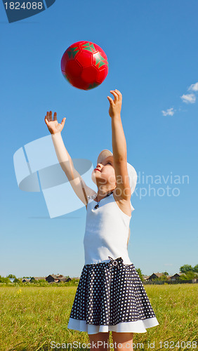 Image of The little girl on the lawn