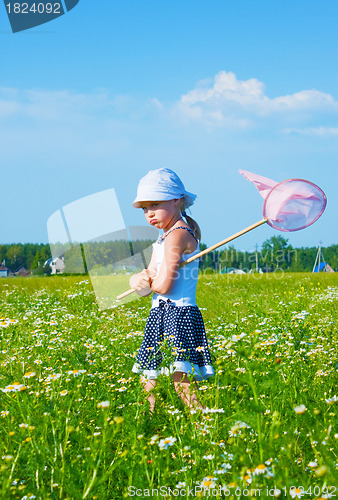 Image of The small angry girl on a meadow