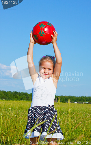 Image of The little girl on the lawn