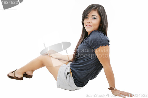 Image of Attractive young girl sitting on the floor. All on white backgro