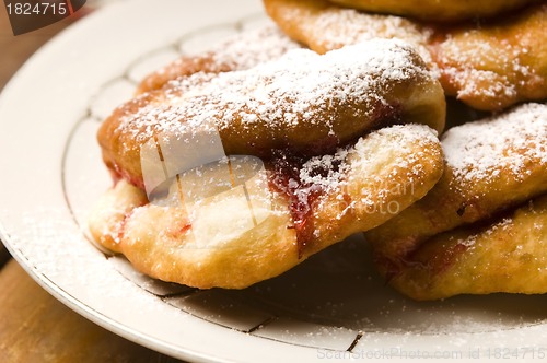 Image of Dough with marmelade on wooden board