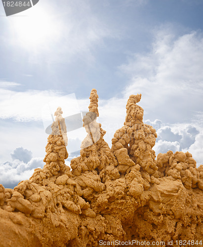 Image of Sand castles on sky background
