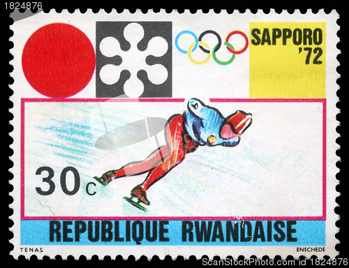 Image of Stamp printed in Rwanda shows Sapporo Olympic Emblem and Speed Skating