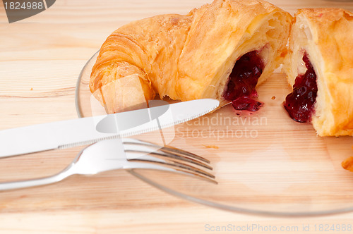 Image of croissant French brioche filled with berries jam