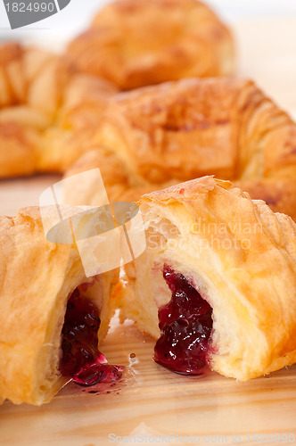 Image of croissant French brioche filled with berries jam