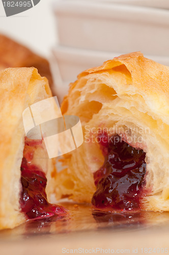 Image of croissant French brioche filled with berries jam