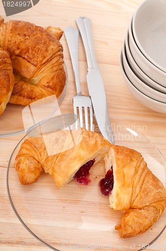 Image of croissant French brioche filled with berries jam