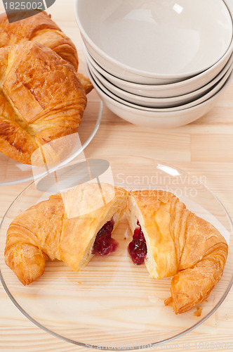 Image of croissant French brioche filled with berries jam