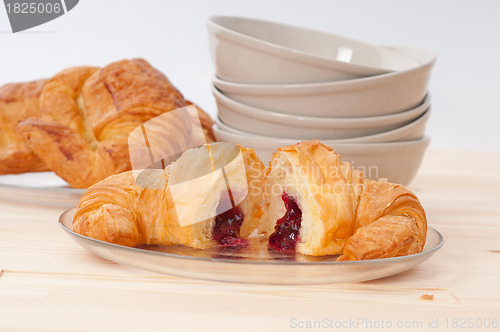 Image of croissant French brioche filled with berries jam