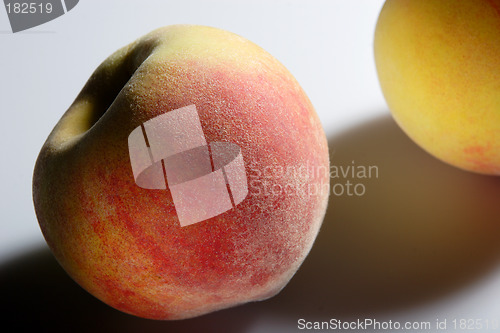 Image of Two peaches and their shadows