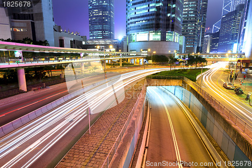 Image of city in night with busy traffic