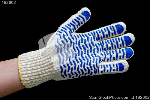 Image of Hand in safety glove isolated on black