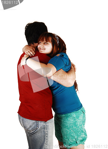 Image of Young couple hugging.