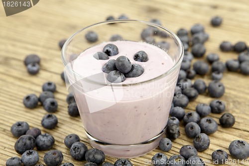 Image of fresh delicious blueberry yoghurt shake dessert on table